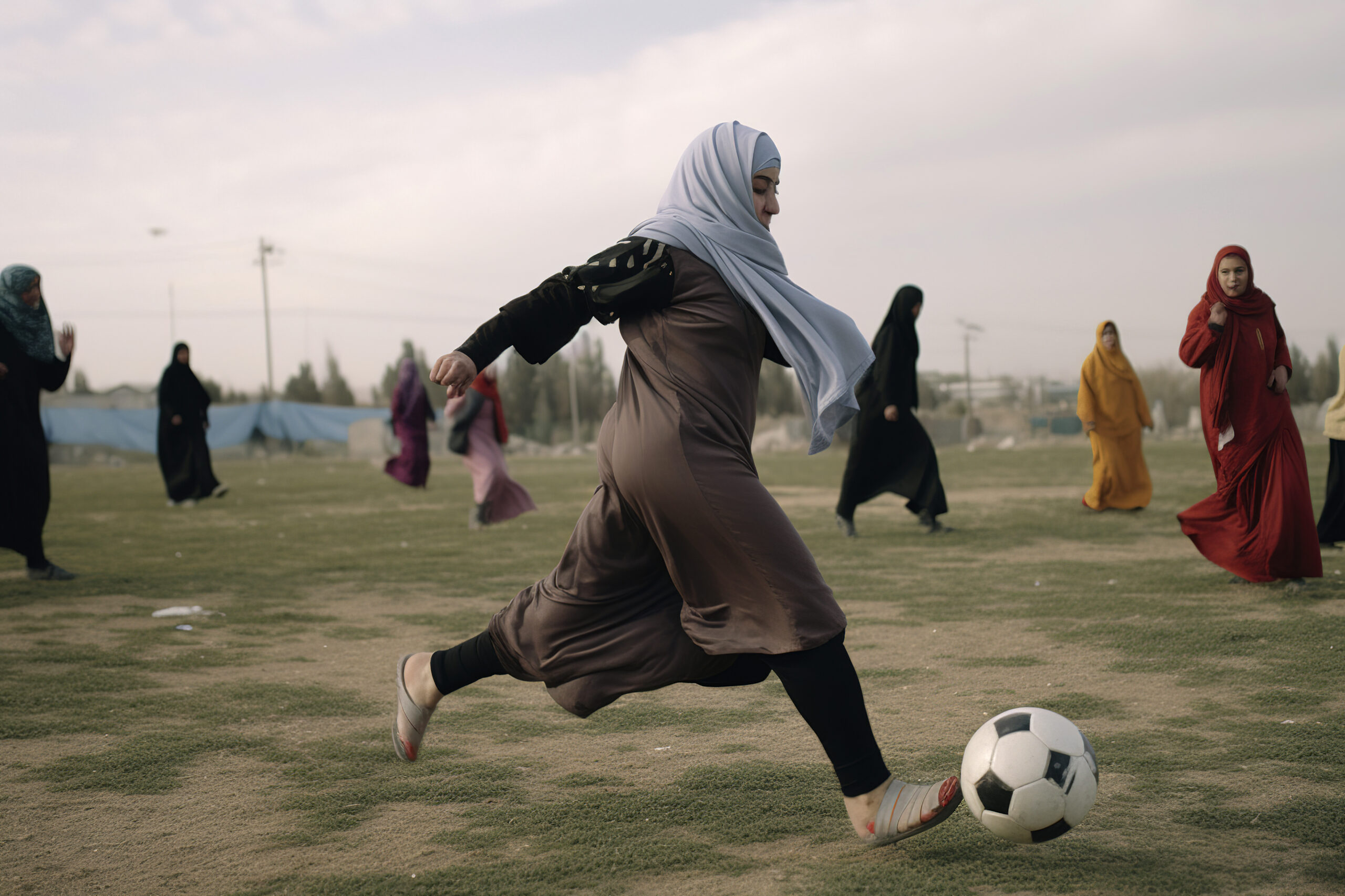 Generative AI illustration of young Arab girls dressed in djellaba and hijab playing soccer. female sport concept